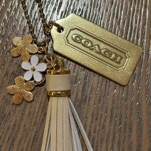 Coach Gold Hangtag and White Floral Keychain with Tassel